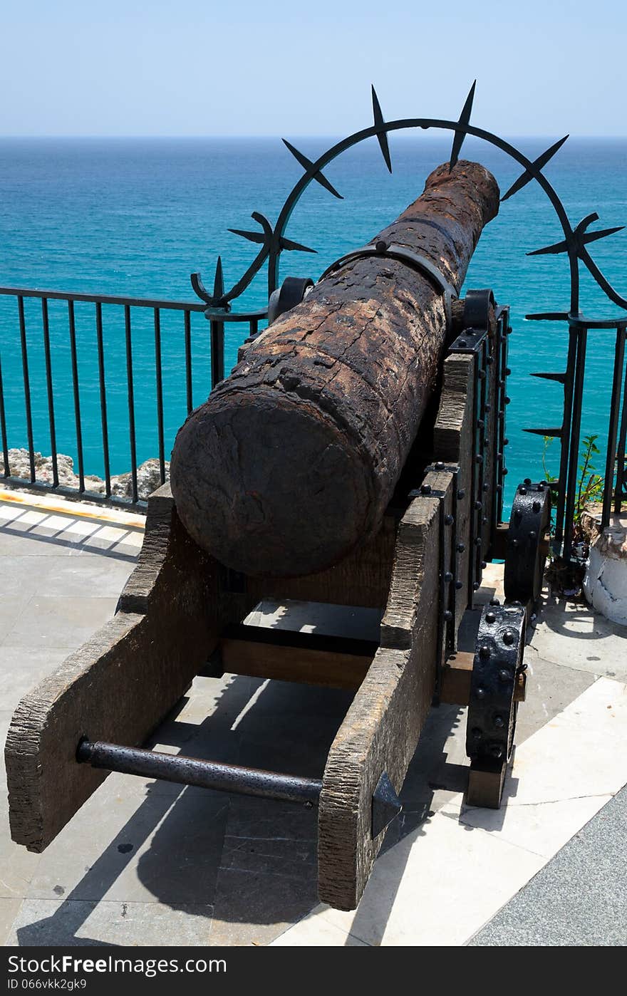 A rusty gun is at the end of the Balcony of Europe. The Balcon de Europa is a promenade built out onto a natural headland in the centre of Nerja. A rusty gun is at the end of the Balcony of Europe. The Balcon de Europa is a promenade built out onto a natural headland in the centre of Nerja.