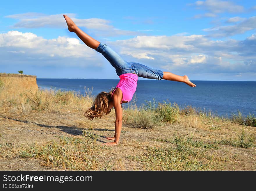 Dancer exercising near the sea