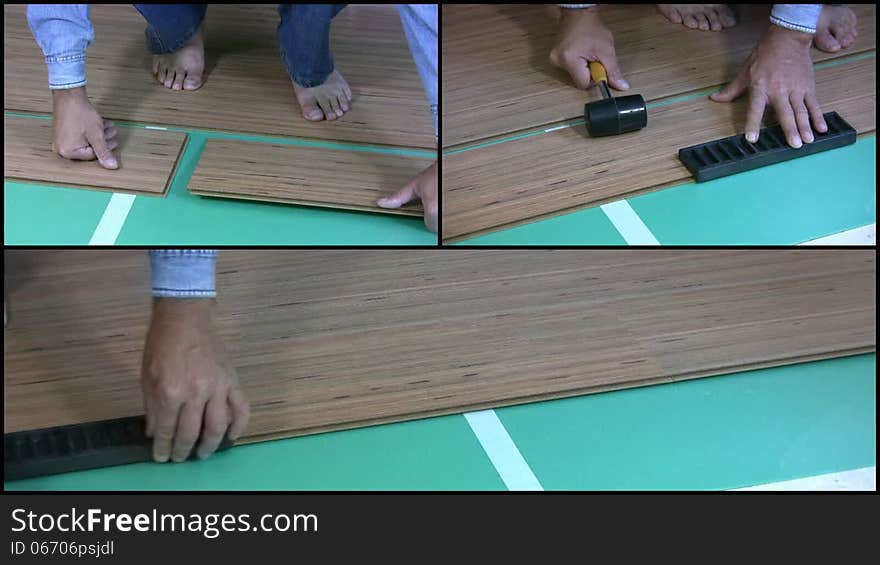 Men barefoot in blue jeans and blue denim shirt, puts on the floor of the room laminate. Close-up. Visible legs, hands and tools. Men barefoot in blue jeans and blue denim shirt, puts on the floor of the room laminate. Close-up. Visible legs, hands and tools