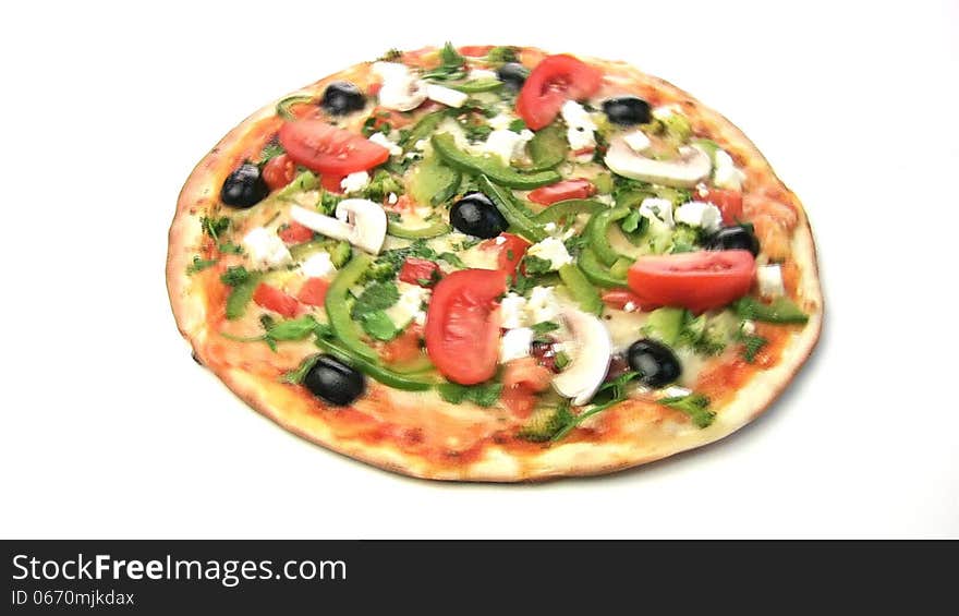 Vegetarian pizza rotate, showing all of its stuffing: peppers, olives, tomatoes, mushrooms, feta cheese, mozzarella