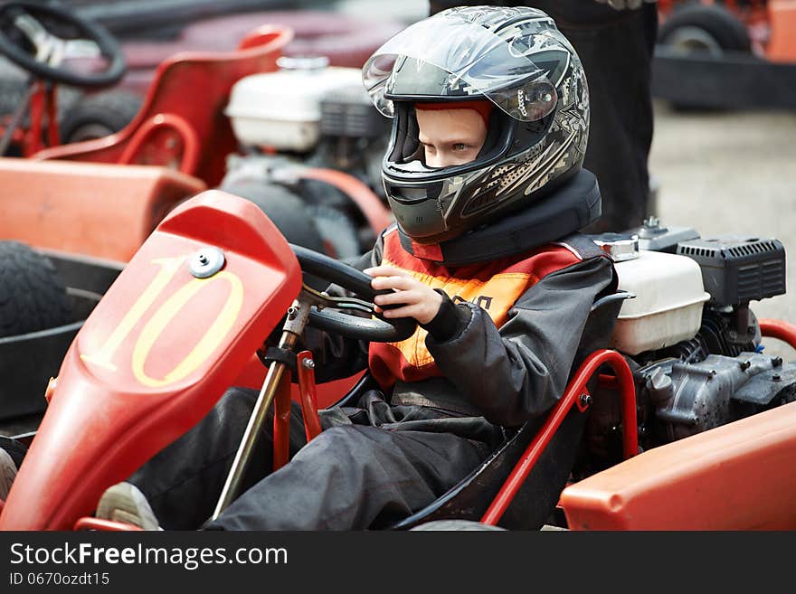 Children karting on start of track closeup