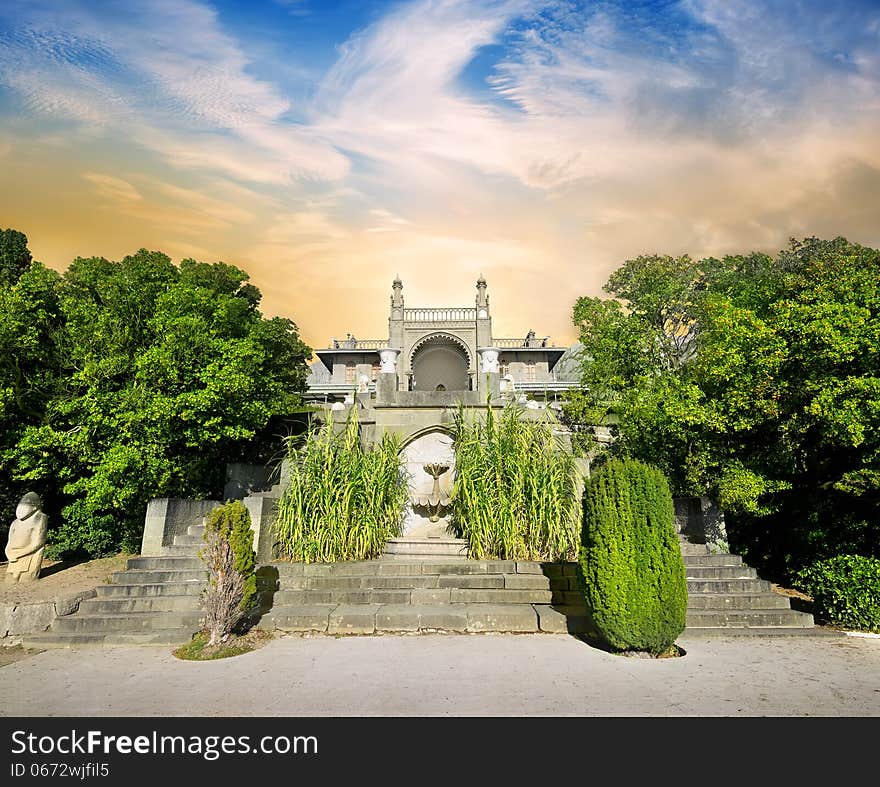 Stairs and palace in beautiful green garden