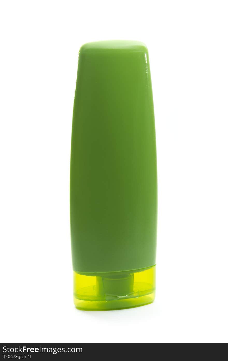 Green plastic cosmetic bottle isolated on white background. Green plastic cosmetic bottle isolated on white background