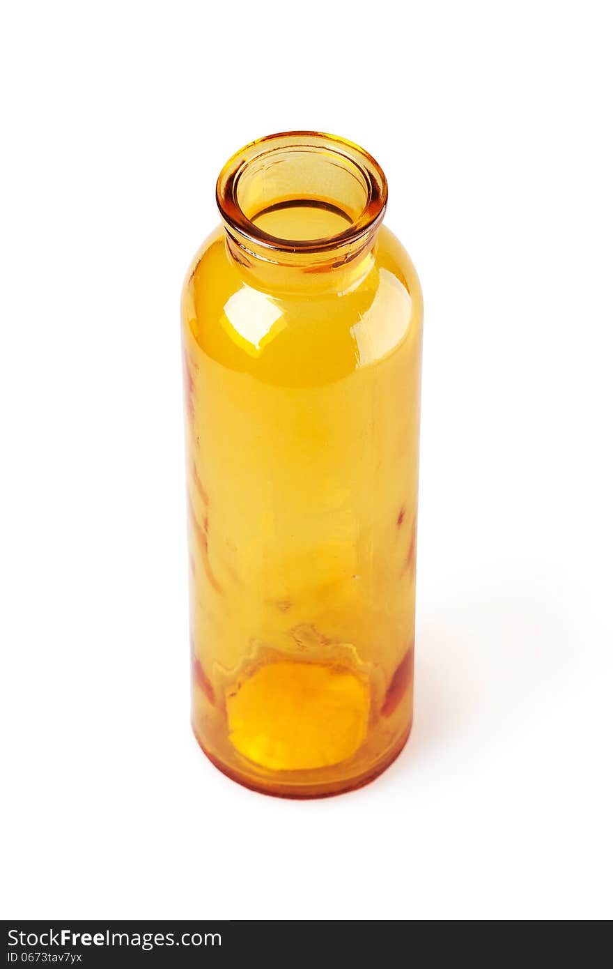 Yellow glass bottle on a white background. Yellow glass bottle on a white background