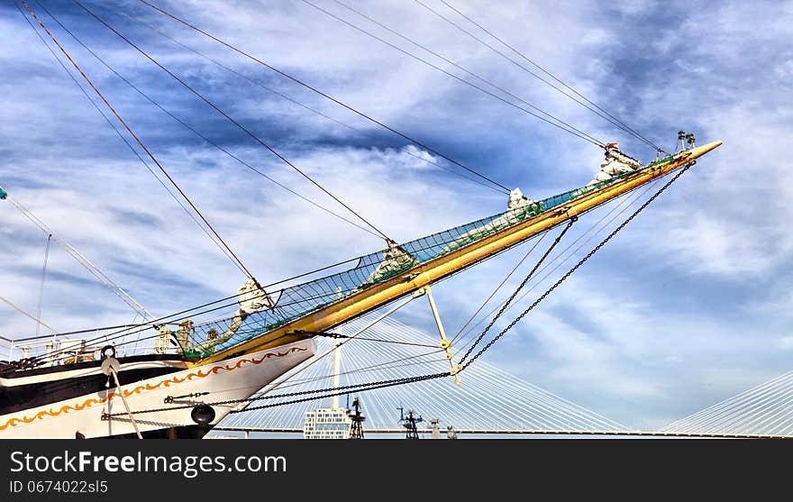 Big sailing vessel against the blue sky in the bright sunny day