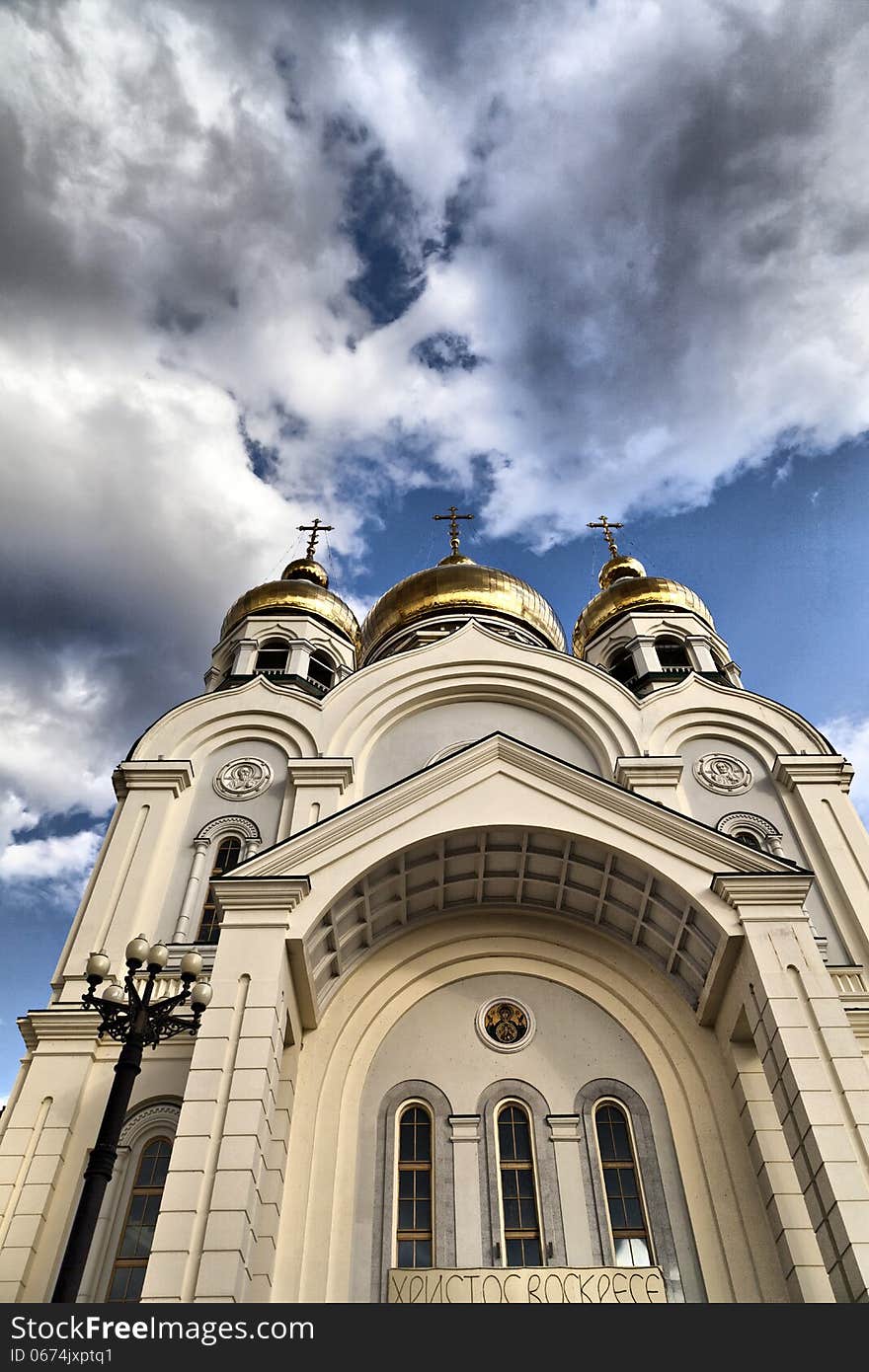 The orthodox temple in the light of a bright sun