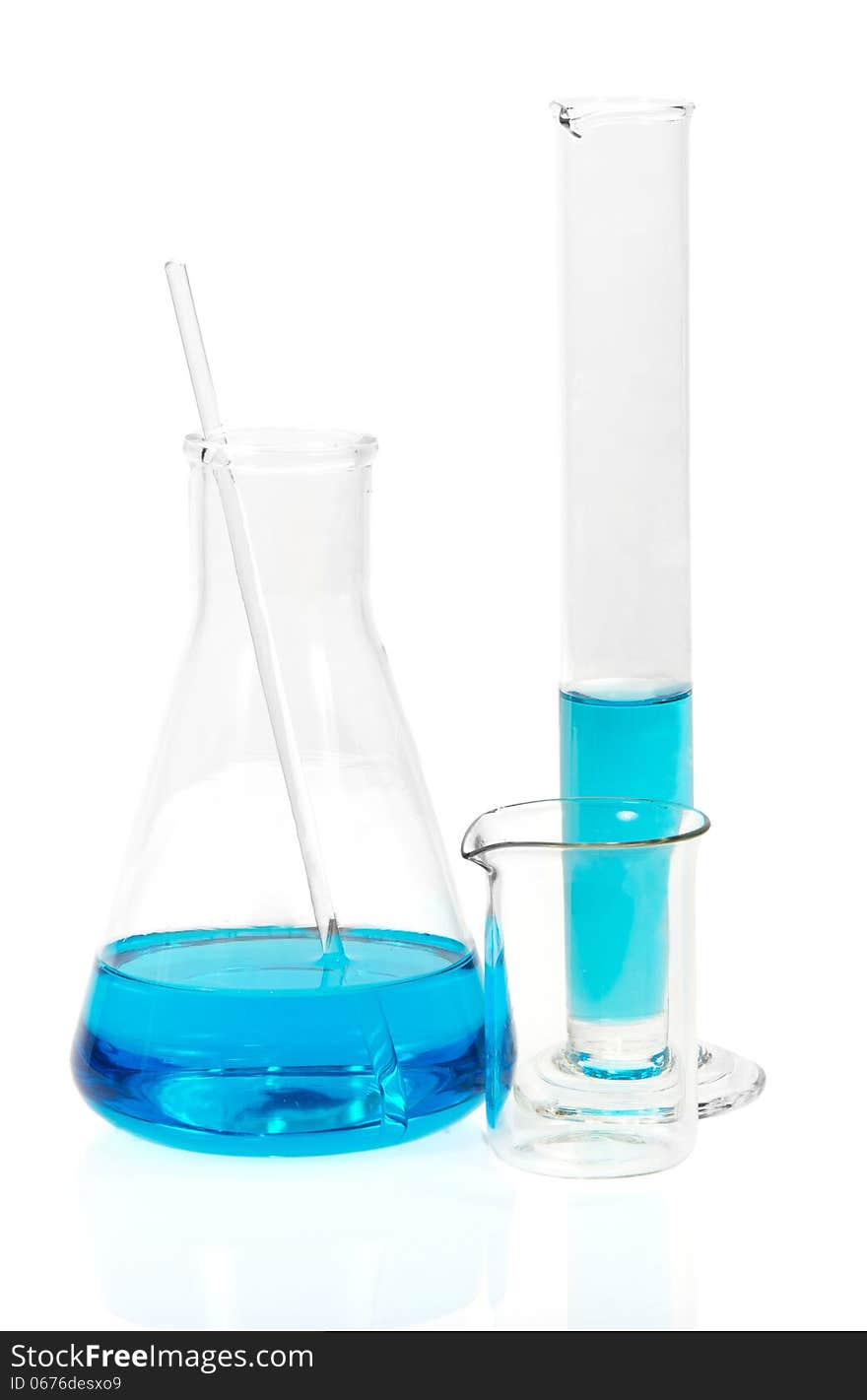 Laboratory glassware with blue liquid on white