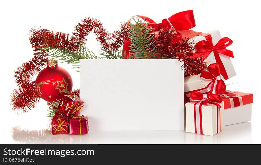 Set of the various gift boxes, the decorated branch of a fir-tree and empty card on white. Set of the various gift boxes, the decorated branch of a fir-tree and empty card on white