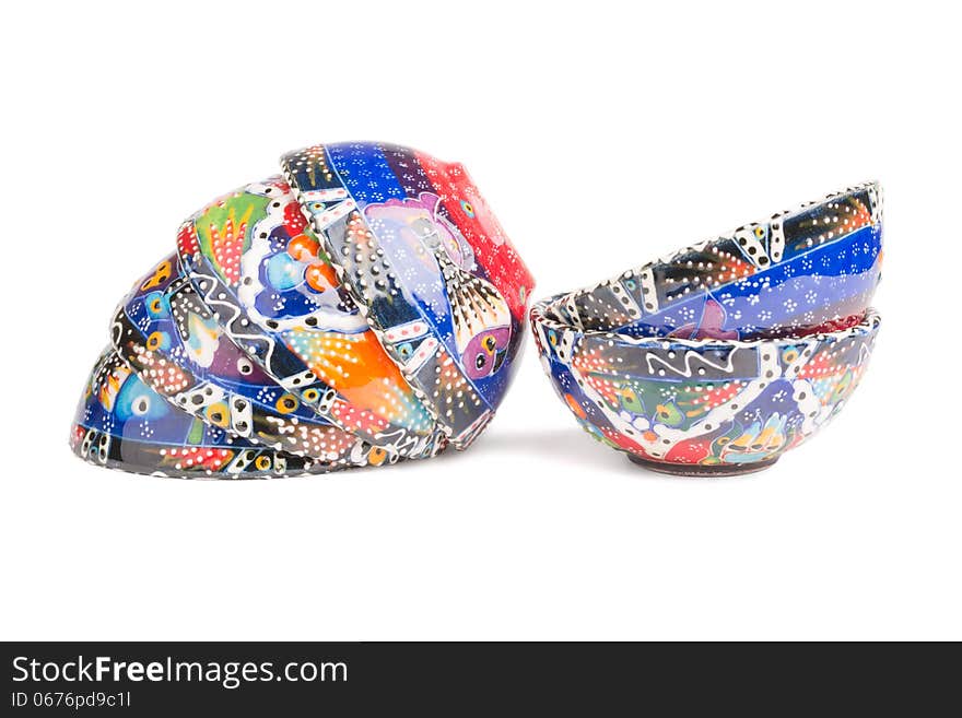 Multi colored handmade pottery art on white background