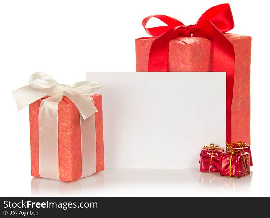 Set of different gift boxes and the empty card for messages isolated on white