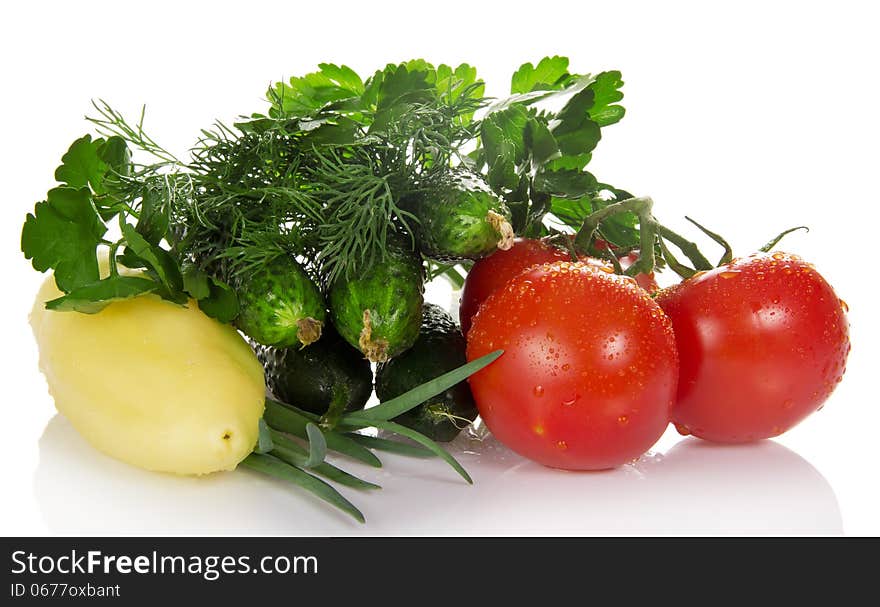 Tomatoes, cucumbers, pepper, parsley, dill and the onions isolated on white