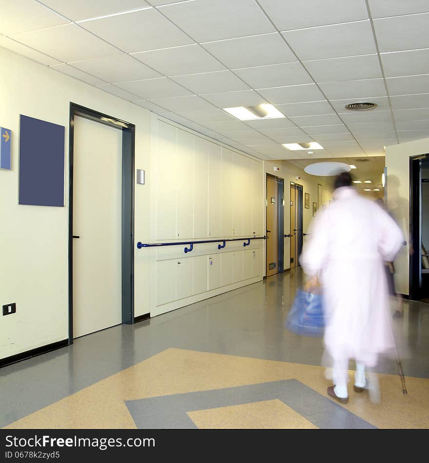 Hospital ward with a patient on move