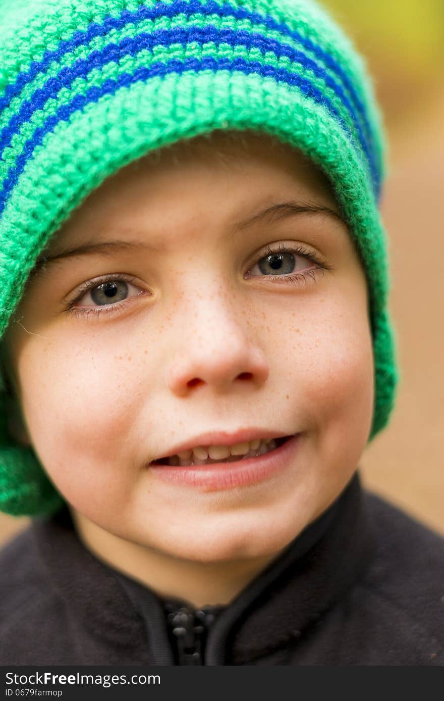 Portriat of a kid wearing a knit cap. Portriat of a kid wearing a knit cap