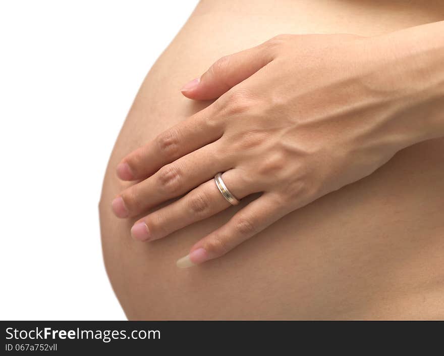 Belly and hands of the pregnant woman