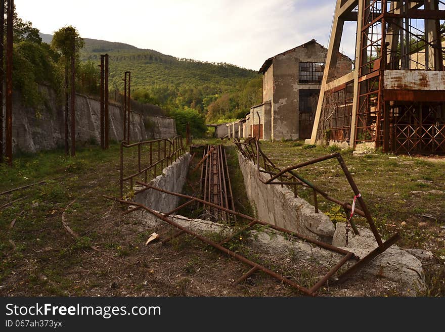 Sty ruabandoned industrial machinery in mountains landscape. Sty ruabandoned industrial machinery in mountains landscape