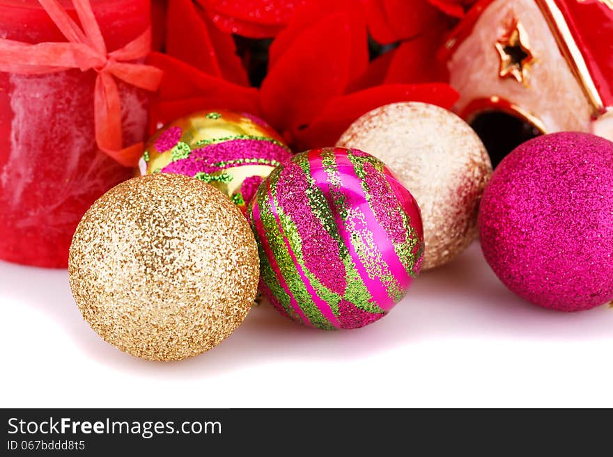 Christmas colorful balls with holly berry flowers and candle closeup image. Christmas colorful balls with holly berry flowers and candle closeup image.