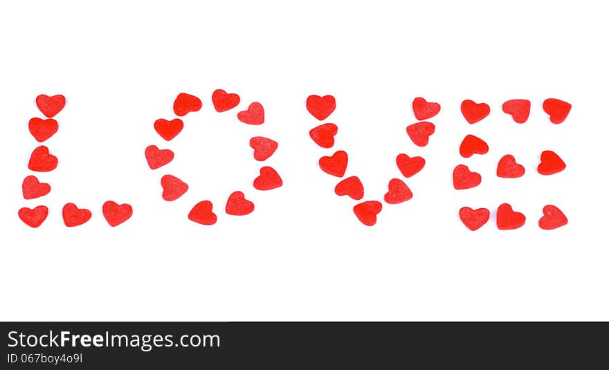 Red Sweet Shape Hearts Laid out Word Love isolated on white background. Red Sweet Shape Hearts Laid out Word Love isolated on white background