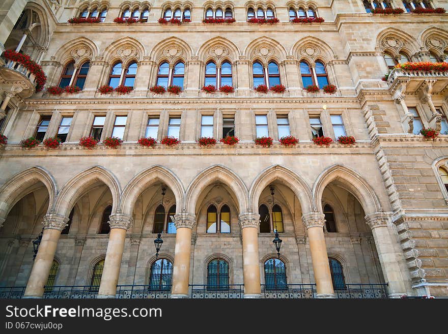 Part of the Rathaus in Vienna with windows decorated with flowers. Part of the Rathaus in Vienna with windows decorated with flowers