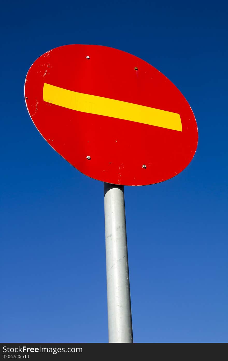 Vibrant road sign against clear blue sky. Vibrant road sign against clear blue sky