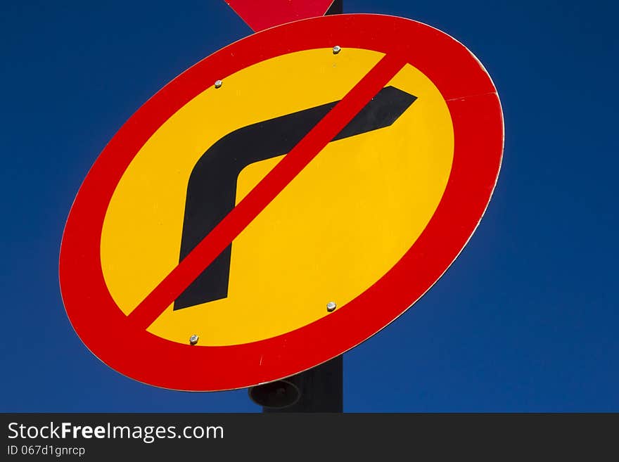 Vibrant road sign against clear blue sky. Vibrant road sign against clear blue sky