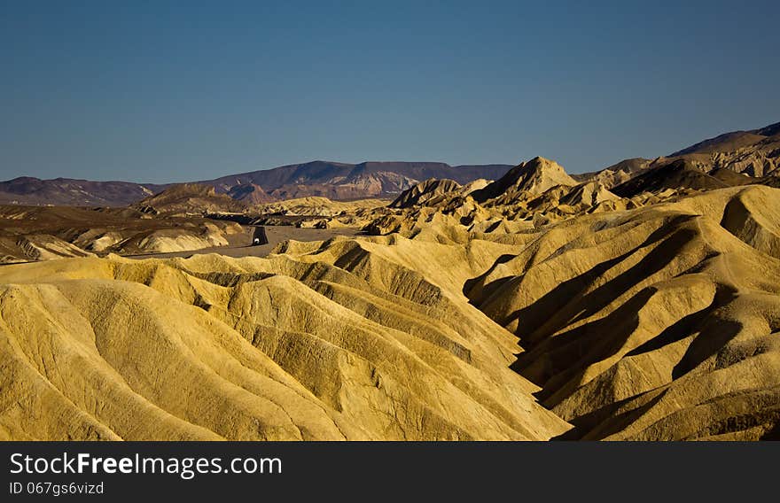 A caravan go through Zabriskie Point on a spring day. A caravan go through Zabriskie Point on a spring day