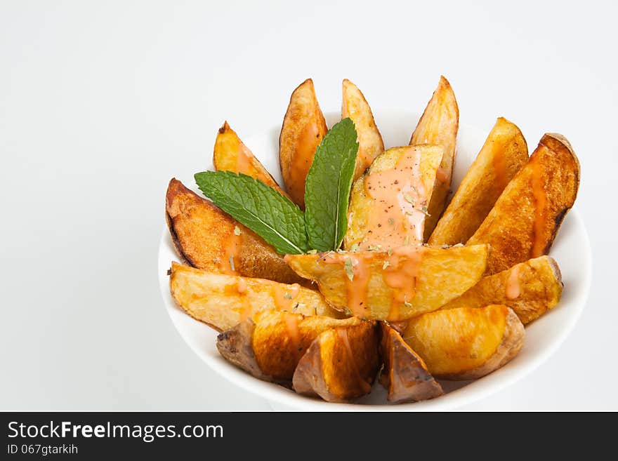 Fried potatoes with spicy sauce. Fried potatoes with spicy sauce.