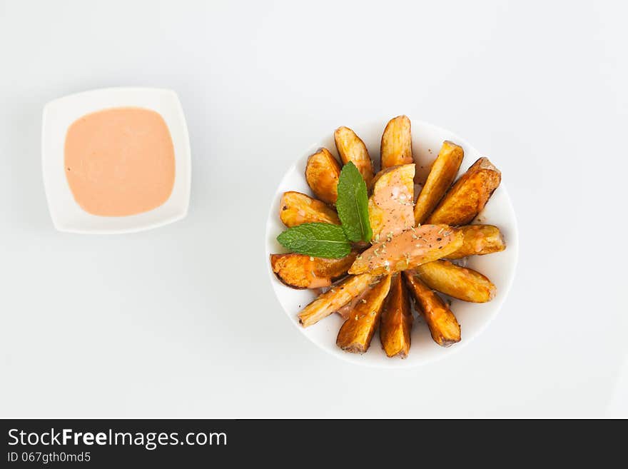 Fried potatoes with spicy sauce. Fried potatoes with spicy sauce.