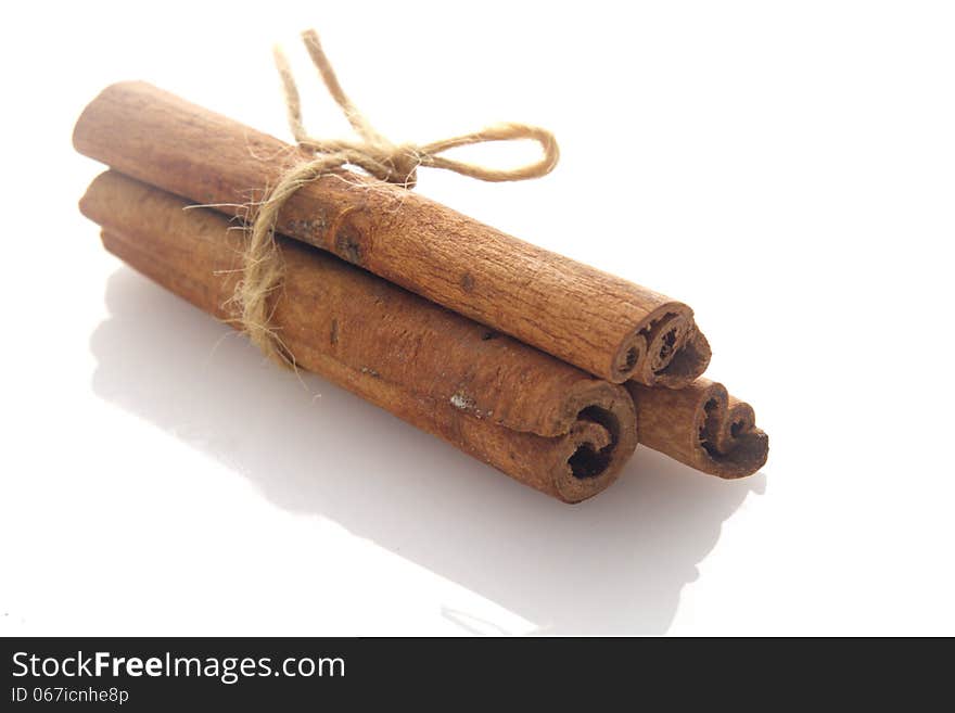 Three stick of Cinnamon over white background