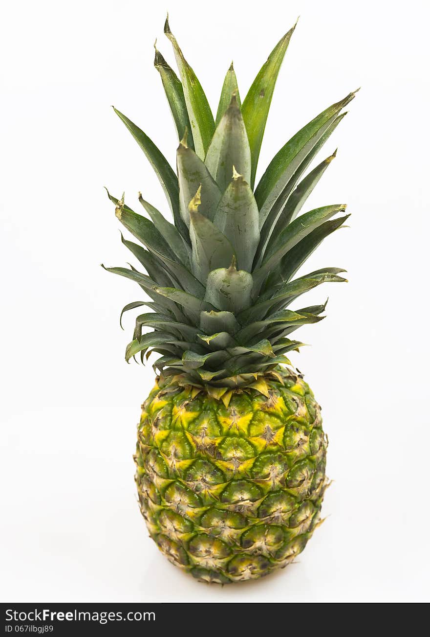 Diagonal photo of a fresh pineapple on a white background. Diagonal photo of a fresh pineapple on a white background