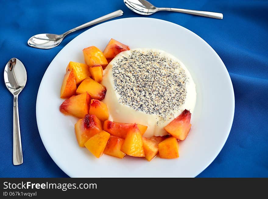 Creamy dessert panncotta with peachs