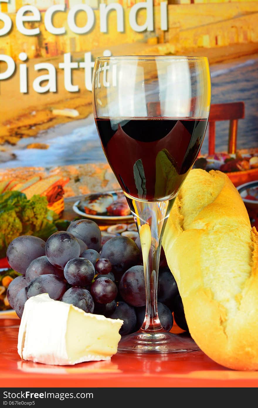 Wine, cheese, grapes and bread. Wine, cheese, grapes and bread