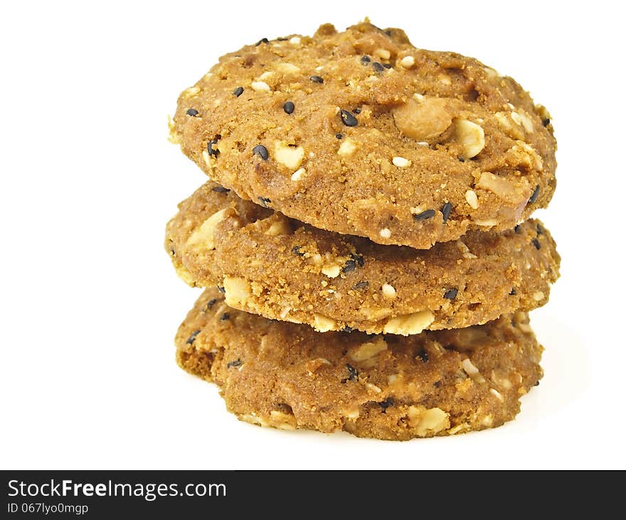 Tower stack of three whole grains cookies on white background. Tower stack of three whole grains cookies on white background