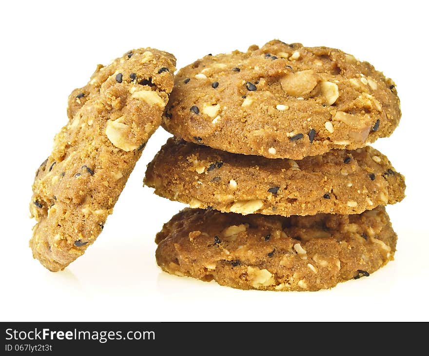 Stack of delicious whole grains cookies on white background. Stack of delicious whole grains cookies on white background