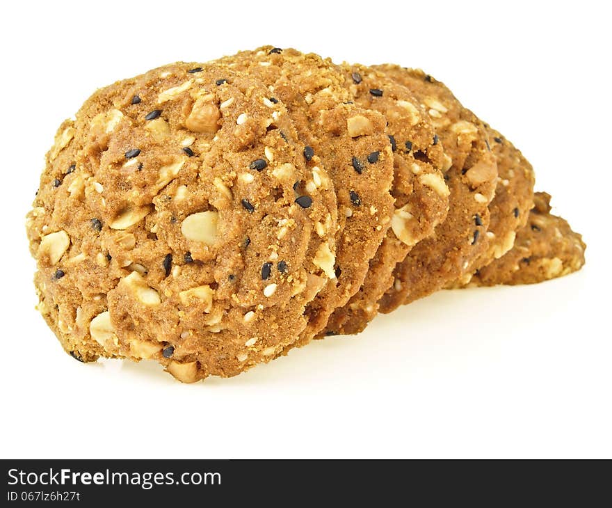 Sequence pile of whole grains cookies like worm shape on white background. Sequence pile of whole grains cookies like worm shape on white background