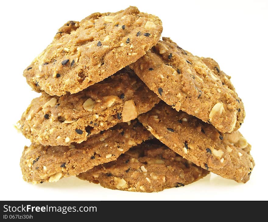 Stack of whole grains cookies in tree shape on white background. Stack of whole grains cookies in tree shape on white background