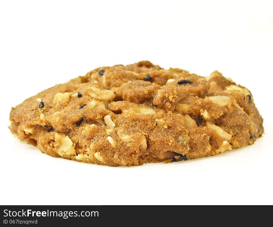 Piece of whole grains cookies on white background