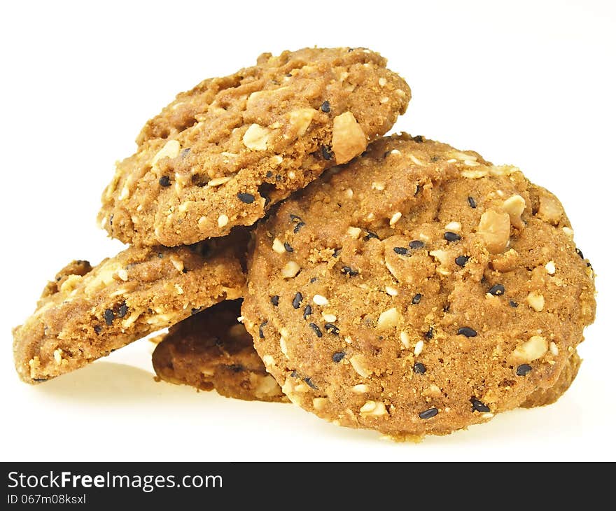 Pile of delicious whole grains cookies on white background. Pile of delicious whole grains cookies on white background