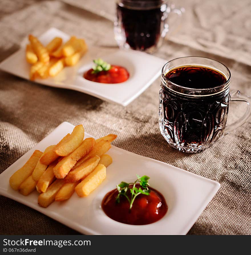 French fries and sauce dish with the Russian kvass. French fries and sauce dish with the Russian kvass