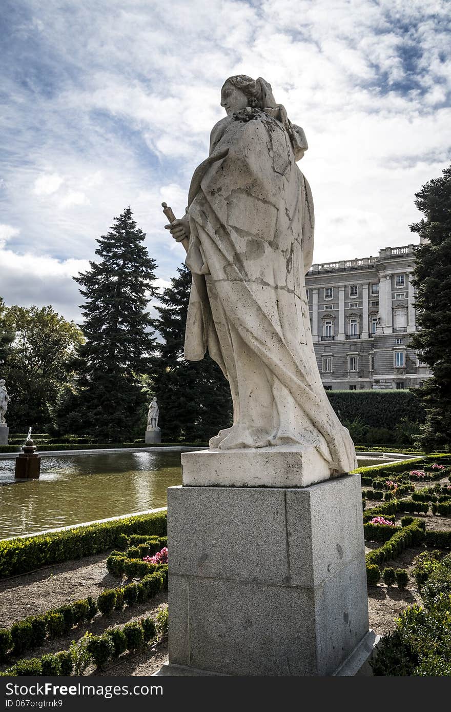 Royal Palace in Madrid with blue sky and sculpture. Royal Palace in Madrid with blue sky and sculpture