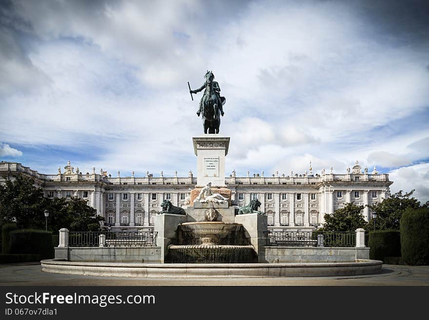 Royal Palace in Madrid with blue sky and sculpture. Royal Palace in Madrid with blue sky and sculpture