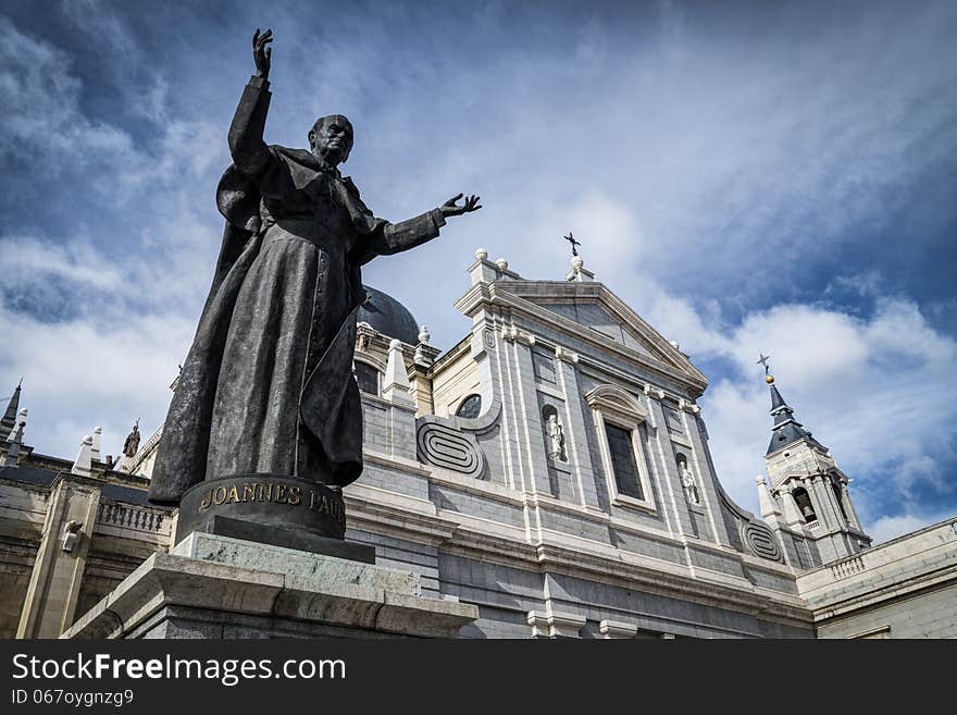 Almudena Cathedral with Pope John Paul II sculpture in Madrid closed up