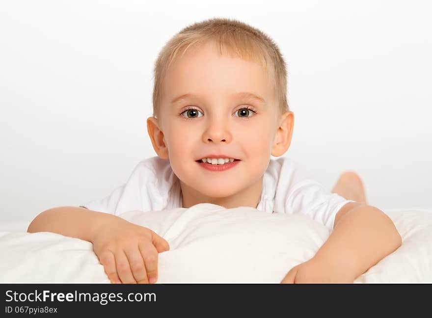 Happy Child Little Boy  In Bed