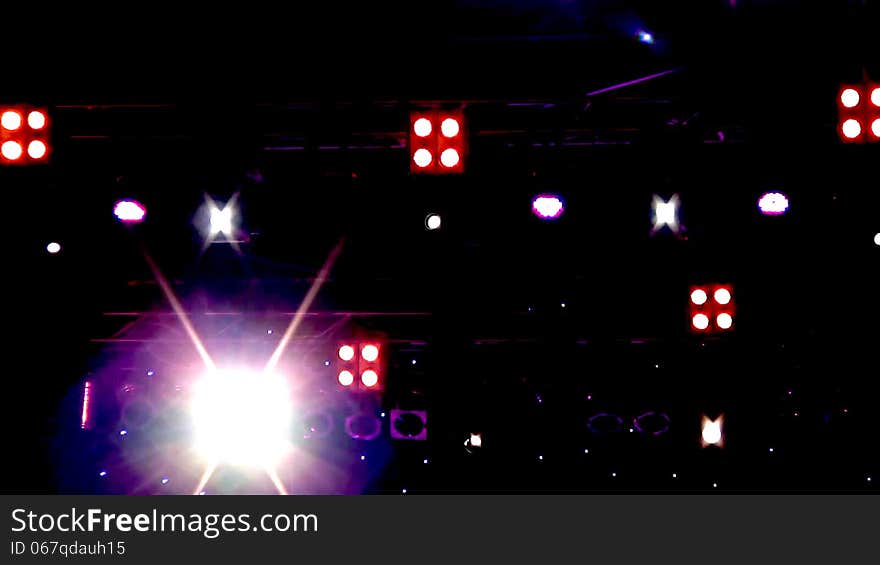Blinking and moving lighting equipment (spotlights) on stage during a concert of jazz music. Blinking and moving lighting equipment (spotlights) on stage during a concert of jazz music