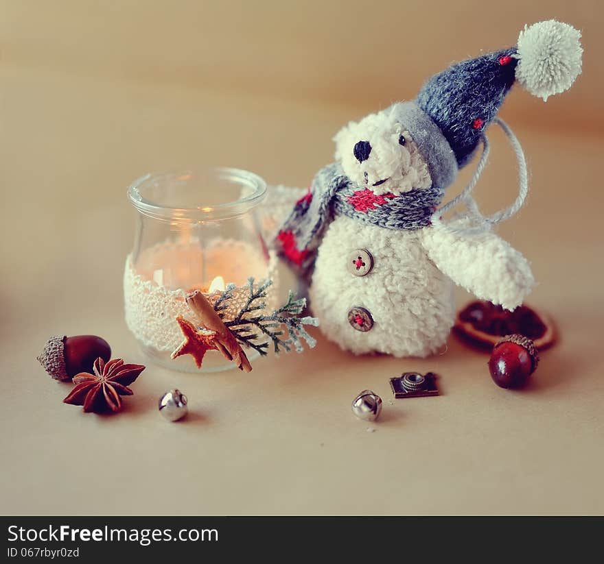 New Year's still life beautiful glass bottles with fire and bear snowman. New Year's still life beautiful glass bottles with fire and bear snowman