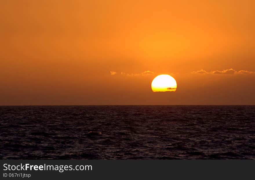 Sunset and few clouds at Atlantic Ocean. Sunset and few clouds at Atlantic Ocean