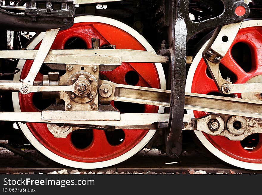 Red wheels close-up of an old steam locomotive. Red wheels close-up of an old steam locomotive