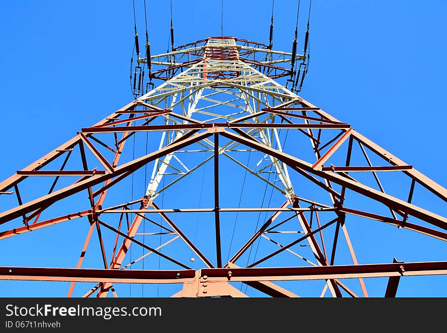 High-voltage tower and sky background.