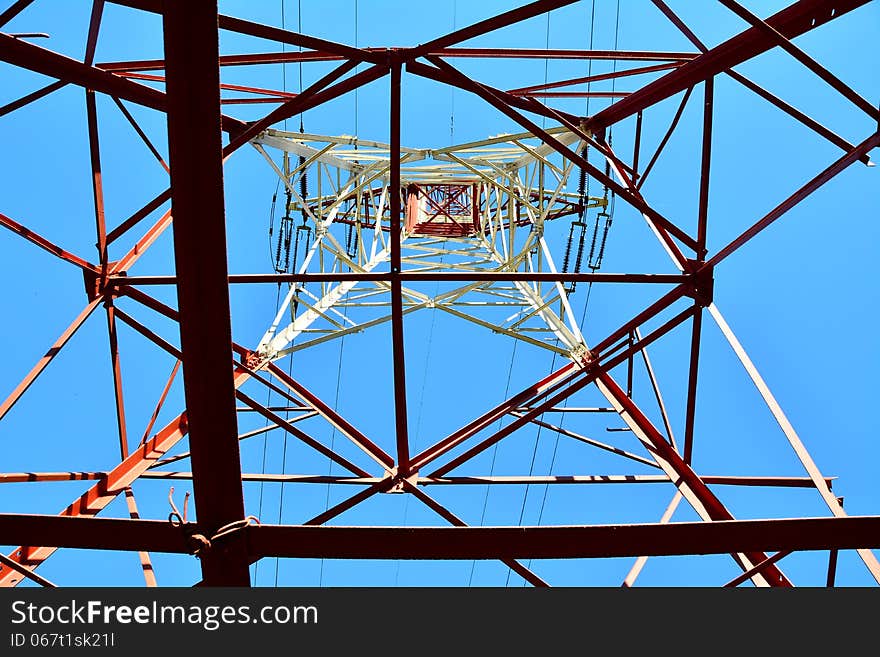 Blue Sky And High Voltage Pole.