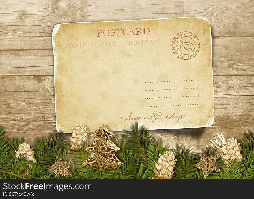 Christmas vintage background with postcard and beautiful Christmas golden cones. Christmas vintage background with postcard and beautiful Christmas golden cones