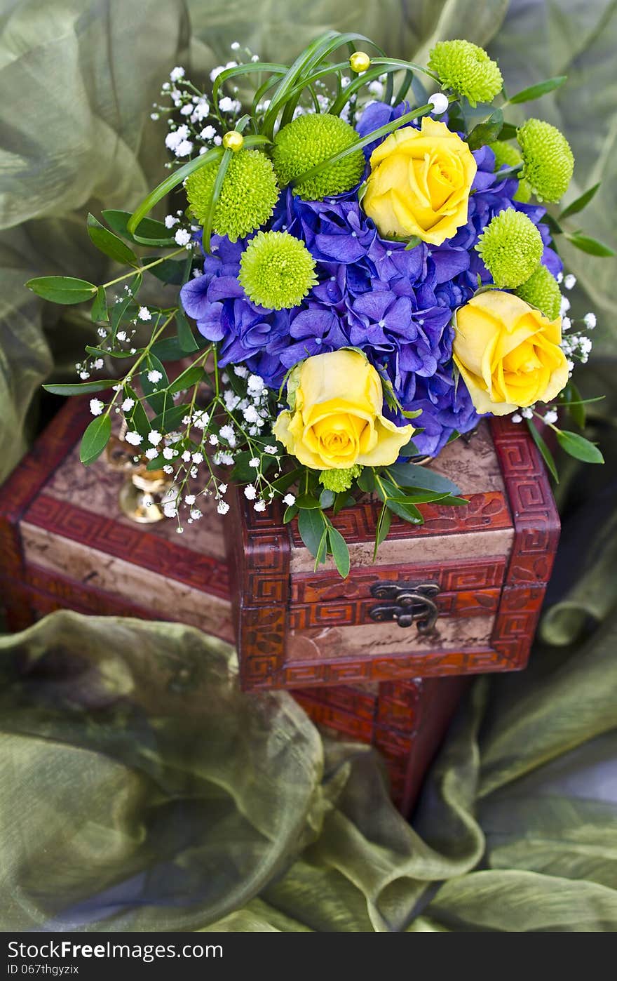 Bridal bouquet with yellow roses on wooden box. Bridal bouquet with yellow roses on wooden box